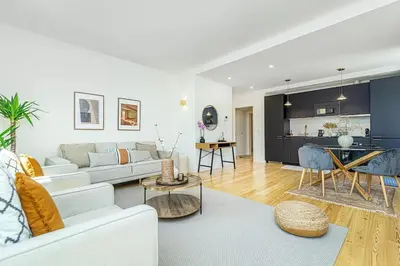 a living room with a couch and a table at Monte dos Judeus I by Innkeeper in Porto