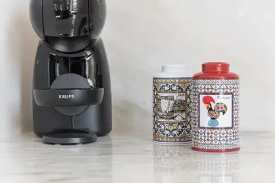 a coffee maker and a can on a table at GuestReady - Porto Wine District Penthouse in Vila Nova de Gaia