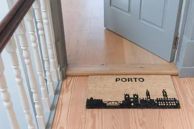 a floor mat with a train on it in a hallway at GuestReady - Porto Wine District Penthouse in Vila Nova de Gaia