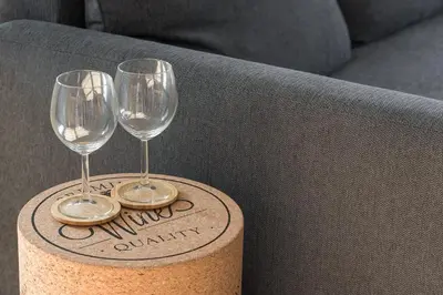 two wine glasses sitting on top of a box at GuestReady - Porto Wine District Penthouse in Vila Nova de Gaia