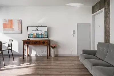 a living room with a couch and a table at GuestReady - Grayscale in Porto