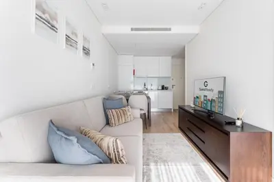 a living room with a white couch and a table at GuestReady - Ideal stay near Estádio do Dragão in Porto