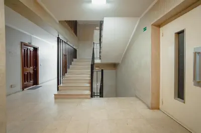 an empty hallway with stairs in a building at Downtown Stylish Apartment With Garage by Vacationy in Porto