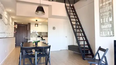 a kitchen and living room with a table and chairs at HEART OF THE CITY 1 ! in Vila Nova de Gaia