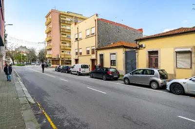 a street with cars parked on the side of the road at WHome Porto City Center Comfort & Stylishly Furnished in Porto