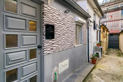 a door to a building with a brick wall at WHome Porto City Center Comfort & Stylishly Furnished in Porto