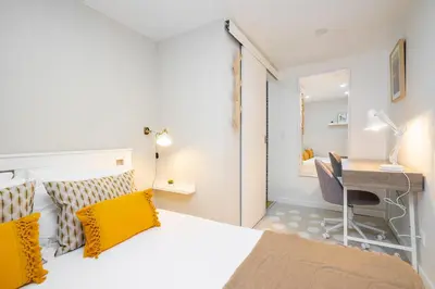 a small bedroom with a bed and a desk at WHome Porto City Center Comfort & Stylishly Furnished in Porto
