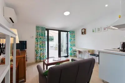 a living room with a couch and a table at Urban Cabin in Vila Nova de Gaia
