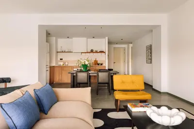 a living room with a couch and a kitchen at The Rebello Hotel & Spa - Small Luxury Hotels Of The World in Vila Nova de Gaia