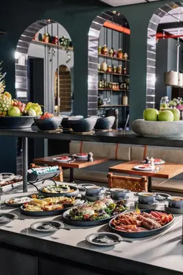 a buffet with many plates of food on a table at The Rebello Hotel & Spa - Small Luxury Hotels Of The World in Vila Nova de Gaia