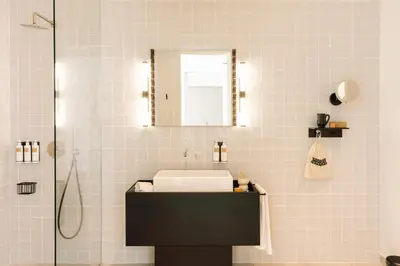 a bathroom with a sink and a mirror at The Rebello Hotel & Spa - Small Luxury Hotels Of The World in Vila Nova de Gaia
