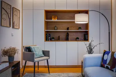 a living room with a couch and a chair at Design Antas Home in Porto