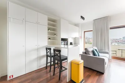 a living room with a couch and a table in a room at GuestReady - Almada 516 in Porto
