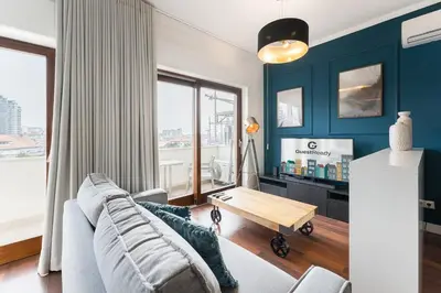 a living room with a couch and a table at GuestReady - Almada 516 in Porto