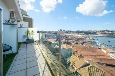 a balcony with a view of a city at GuestReady - Port Studio 4 in Vila Nova de Gaia