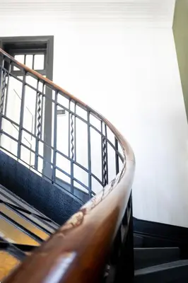 a stairway with a railing in a building at Amazing Family Flat in Center Porto in Porto