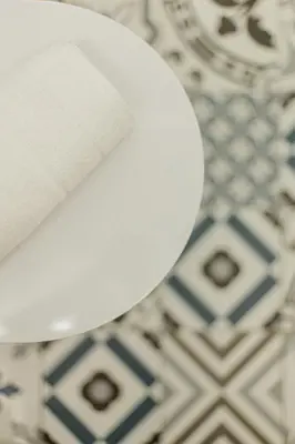 a white knife sitting on top of a table at Ribeira Charming Apartment in Porto