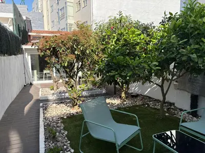 an aerial view of a garden with benches on a building at InLapa Studio IV Porto Garden View in Porto