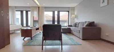 a bedroom with a bed and two lamps and a window at Casa do Teatro Oporto Downtown in Porto
