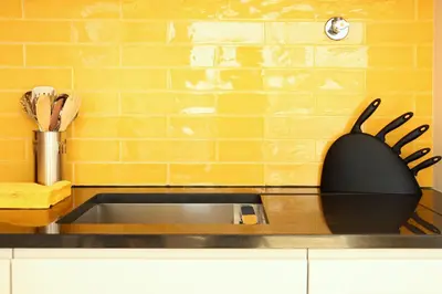 a kitchen sink with a black spider on the wall at Villa Invicta 3 in Porto