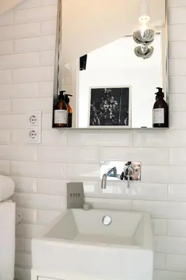 a white bathroom with a sink and a mirror at Villa Invicta 3 in Porto