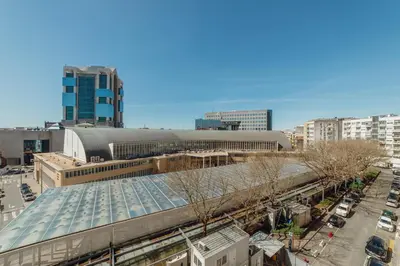 a view of a train station in a city at Grand Premium Boavista Apartment by Vacationy in Porto