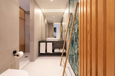 a bathroom with a sink and a toilet at Blau 1911 in Porto
