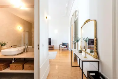 a bathroom with a white sink and a shower at Modern Charming Loft with balcony in central Porto by Lisbeyond in Porto