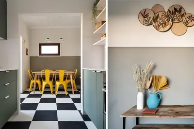 a kitchen and dining room with yellow chairs and a checkered floor at Trendy and Modern 3BR Family Home in Porto
