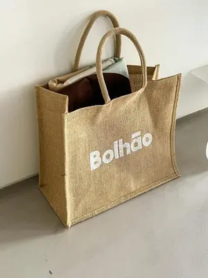 a brown bag with the word pollinator written on it at GuestReady - The Modern Silveira in Porto