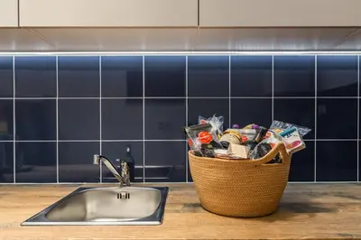 a basket of food sitting next to a sink at OPO Vale Formoso I in Porto