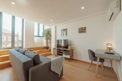 a living room with a couch and a table at Modern & Stylish Apartments by Vacationy in Porto