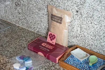 a box and a paper bag on a counter at GuestReady - Blue shades with panoramic city views in Porto