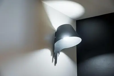 a bird shaped lamp hanging on a wall at GuestReady - Blue shades with panoramic city views in Porto