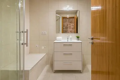 a bathroom with a sink and a shower at GuestReady - Miragaia Stone Studios & Apartments in Porto