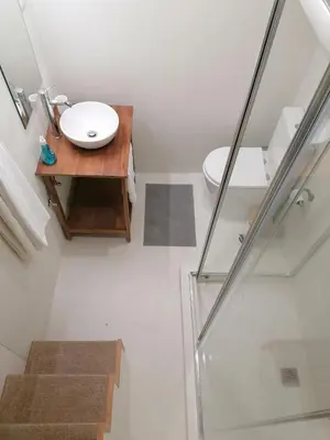a bathroom with a sink and a toilet at Rustic Silent Ensuites - Shared Kitchen - Self check in in Porto