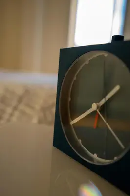 a clock sitting on top of a table at Ilha Douro Duplex in Porto