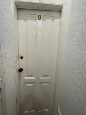 a white door with a gold door knob on it at Guesthouse Franco in Porto