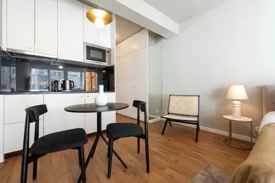 a kitchen with a table and chairs in a room at Ceuta 70 by LovelyStay in Porto