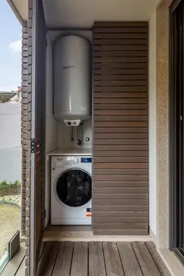 a kitchen with a washer and dryer in a house at Design Flat in Porto Downtown II in Porto