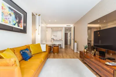 a living room with a couch and a flat screen tv at Design Flat in Porto Downtown II in Porto