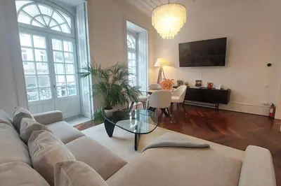 a living room with a couch and a table at Dream on - Clérigos Tower in Porto