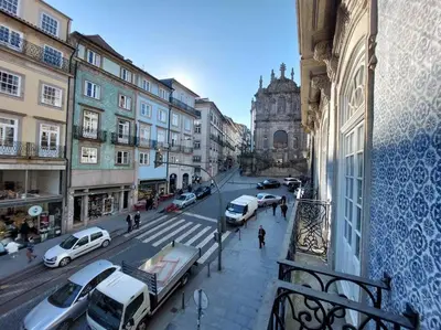 a view of a city with cars parked on a street at Dream on - Clérigos Tower in Porto