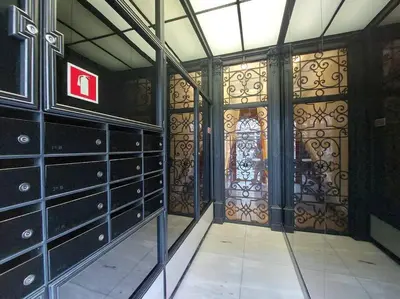 an empty room with a door with wrought iron at Dream on - Clérigos Tower in Porto