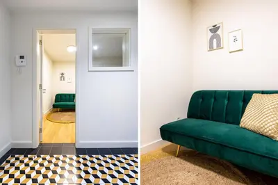 a living room with a green couch and a checkered floor at Aliados luxurious home in Porto