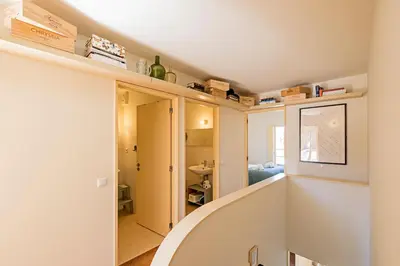 a room with a staircase and a room with a bathroom at Casa 128 by LovelyStay in Porto