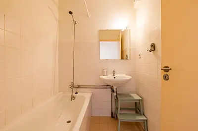 a bathroom with a sink and a bath tub and a sink at Casa 128 by LovelyStay in Porto