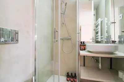 a bathroom with a shower and a sink at Porto Unique Cosy Duplex in Porto