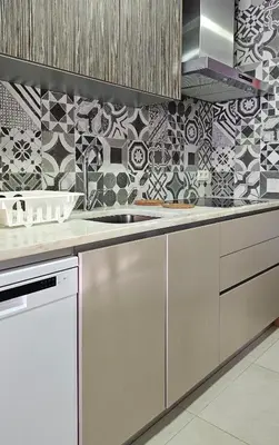 a kitchen with a sink and a tile wall at We are tourist in Vila Nova de Gaia
