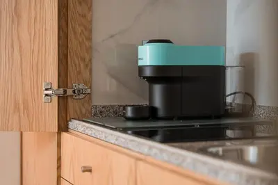 a coffee maker sitting on top of a stove at GuestReady - Miragaia Stone Studios & Apartments in Porto